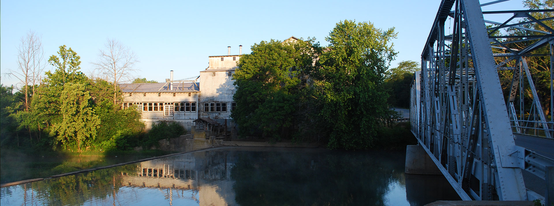 Ozark Mill with bridge and soft river. 